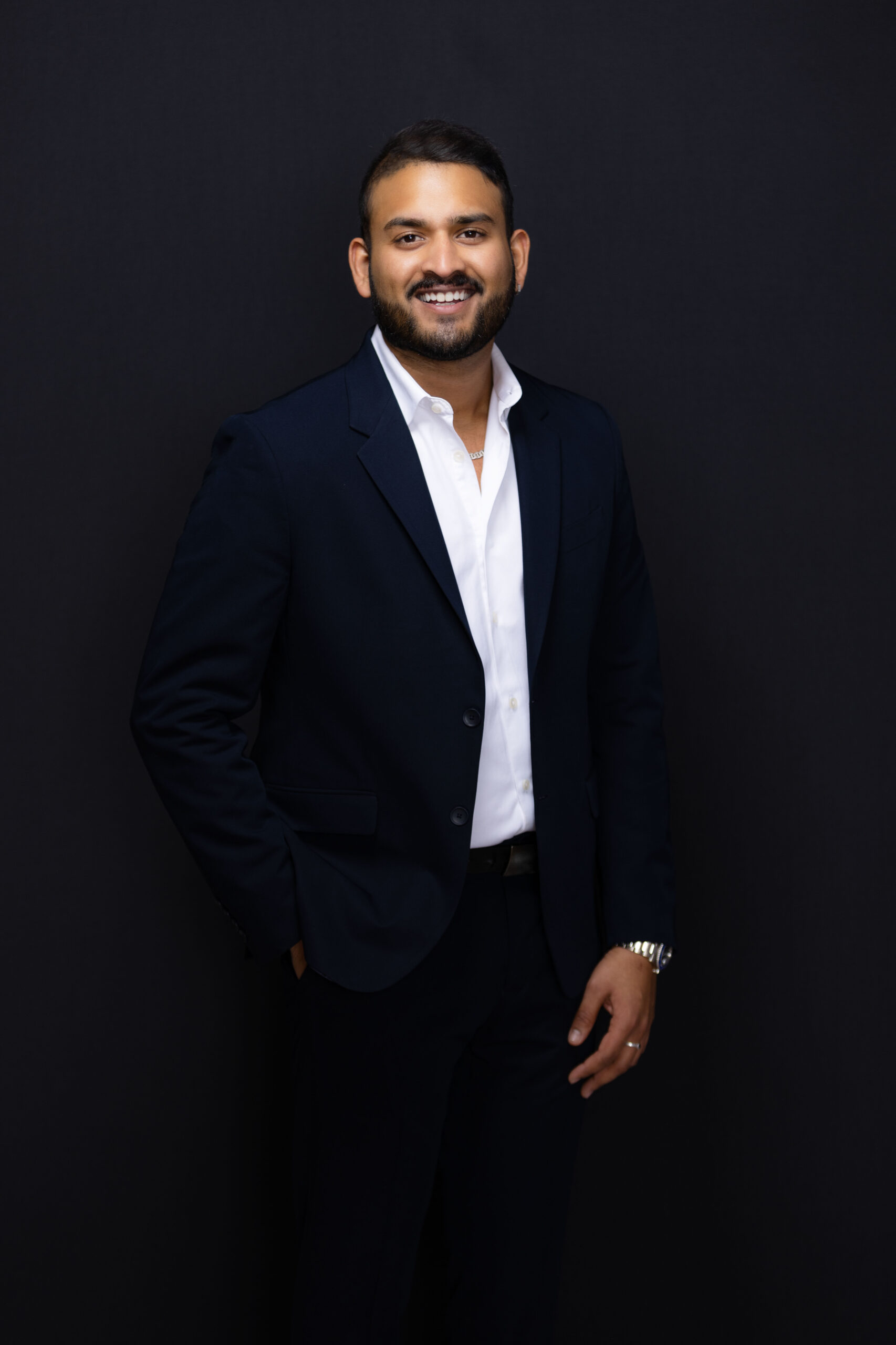 professional photo of DJ Ankit in a suit taken by Mike Rivera Photo